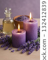A calming arrangement of lavender flowers, candles and essential oil. 132412839