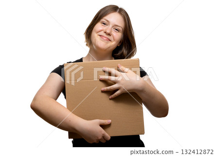 Joyful young woman hugging a cardboard box with smile, isolated on white background, concept of love for delivery. Joyful young woman hugging a cardboard box with smile, isolated on white background, concept of love for delivery. 132412872