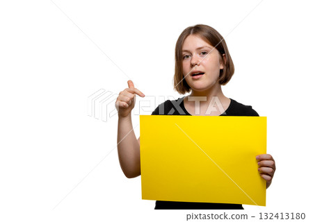 Young woman gesturing and speaking while holding a yellow poster, isolated on white background. Young woman gesturing and speaking while holding a yellow poster, isolated on white background. 132413180