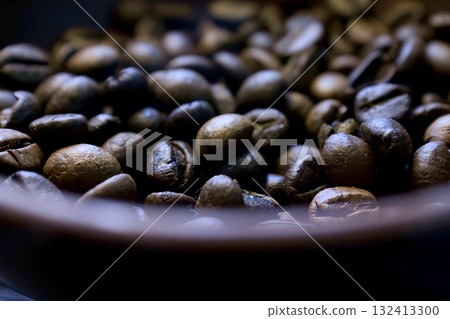 Close-up of coffee beans in a clay pot Close-up of coffee beans in a clay pot 132413300
