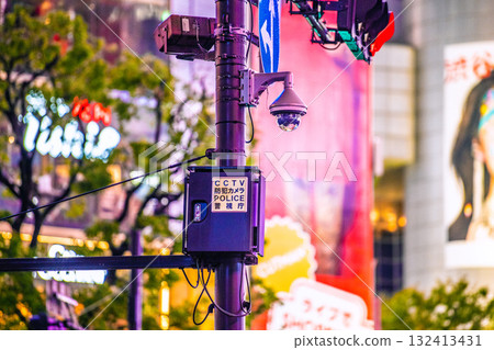 Tokyo cityscape in Japan - Security cameras on street corners. CCTV security cameras at Shibuya Scramble Crossing. POLICE Metropolitan Police Department 132413431