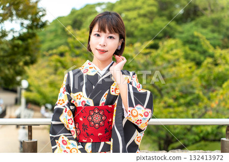 A stylish Japanese woman in a kimono A stylish Japanese woman in a kimono 132413972