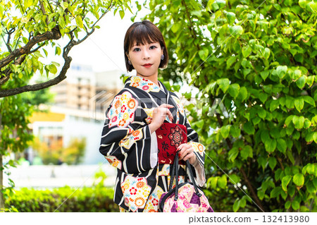 A stylish Japanese woman in a kimono A stylish Japanese woman in a kimono 132413980