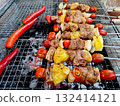 Pork barbecue and chili pepper grilled on charcoal stove 132414121