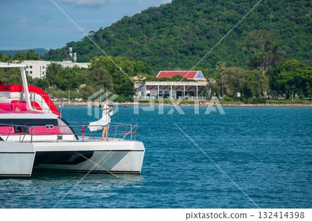 Asian woman photo in yacht over turquoise sea by Koh Larn, Pattaya Asian woman photo in yacht over turquoise sea by Koh Larn, Pattaya 132414398