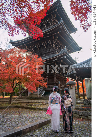 LGBTQ couple in Kimono view Shinnyodo pagoda with fall leaf, Kyoto 132414442