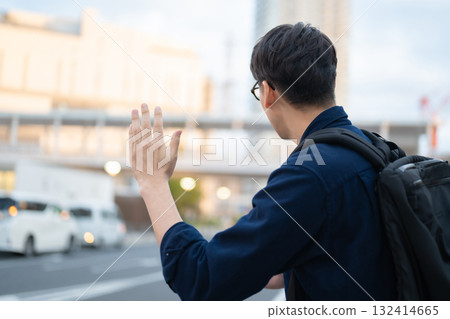 Man calling a taxi Man calling a taxi 132414665