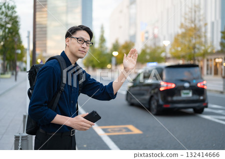 Man calling a taxi Man calling a taxi 132414666