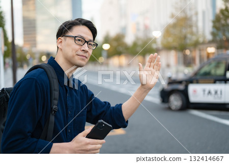 Man calling a taxi 132414667