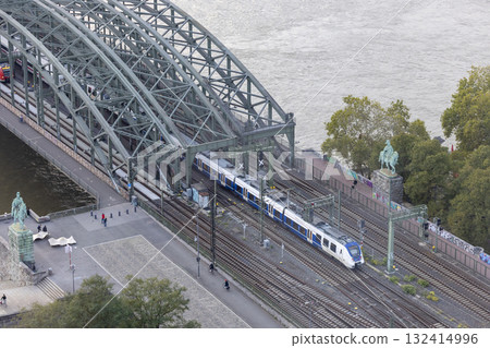 Hohenzollern Bridge in the evening and moving train Hohenzollern Bridge in the evening and moving train 132414996