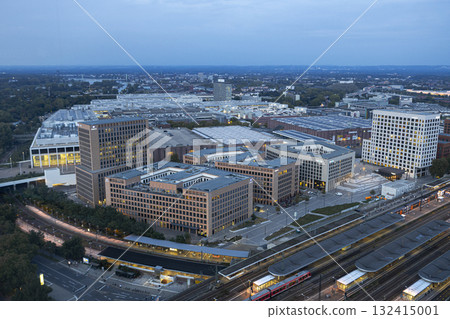 Evening view of Cologne Koelnmesse and railway tracks Evening view of Cologne Koelnmesse and railway tracks 132415001