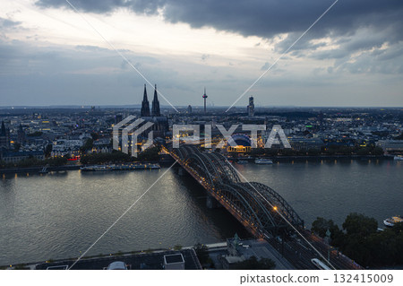 Evening view of Cologne Cathedral and Hohenzollern Bridge in the sunset 132415009