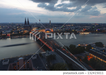 Evening view of Cologne Cathedral and Hohenzollern Bridge in the sunset 132415011