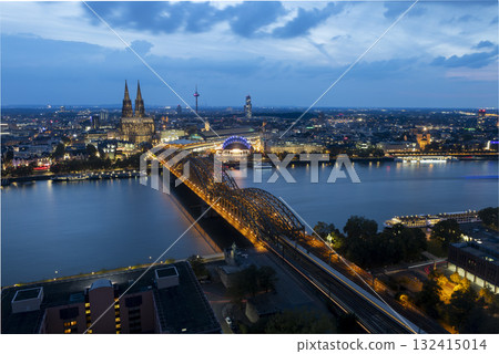 Evening view of Cologne Cathedral and Hohenzollern Bridge in the sunset Evening view of Cologne Cathedral and Hohenzollern Bridge in the sunset 132415014