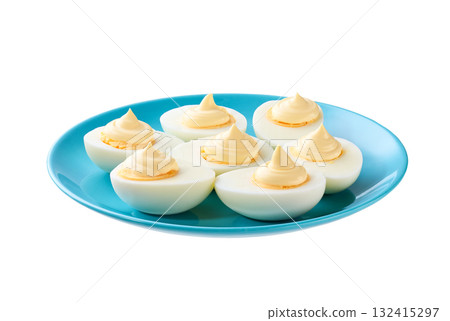 Boiled chicken eggs with mayonnaise in a blue plate isolated on a white background. Boiled chicken eggs with mayonnaise in a blue plate isolated on a white background. 132415297