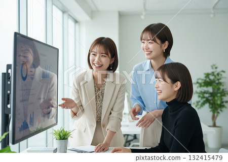 Young female business people aiming for success through teamwork 132415479