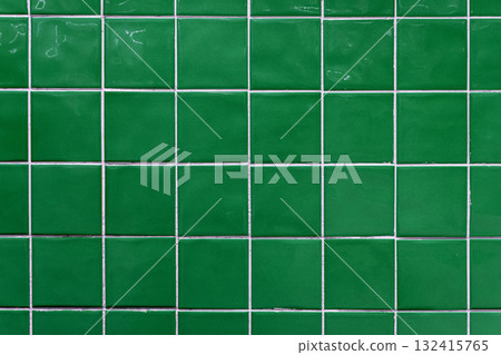 Green ceramic tile background. Old vintage ceramic tiles in green to decorate the kitchen or bathroom Green ceramic tile background. Old vintage ceramic tiles in green to decorate the kitchen or bathroom 132415765