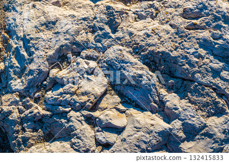 Large rocks in the artificial harbor bay near the village of Roda on the island of Corfu 132415833
