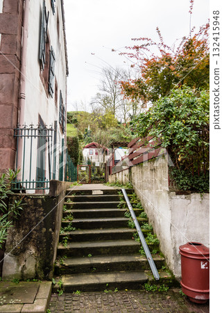 A street lined with historic buildings in Saint-Jean-Pied-de-Port, Basque Country, France 132415948