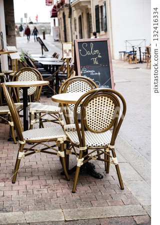 Chairs and tables in a historic street in Saint-Jean-de-Luz, Basque Country, France Chairs and tables in a historic street in Saint-Jean-de-Luz, Basque Country, France 132416334