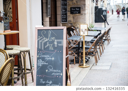 Chairs and tables in a historic street in Saint-Jean-de-Luz, Basque Country, France Chairs and tables in a historic street in Saint-Jean-de-Luz, Basque Country, France 132416335