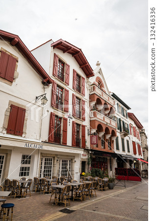 A street lined with historic red and white buildings in Saint-Jean-de-Luz, Basque Country, France A street lined with historic red and white buildings in Saint-Jean-de-Luz, Basque Country, France 132416336
