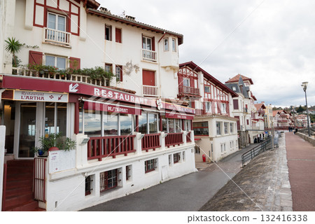 A street lined with historic red and white buildings in Saint-Jean-de-Luz, Basque Country, France A street lined with historic red and white buildings in Saint-Jean-de-Luz, Basque Country, France 132416338