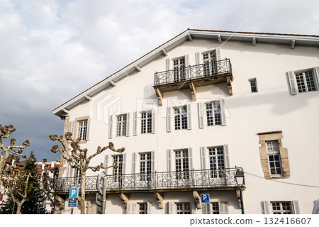 A street lined with historic red and white buildings in Saint-Jean-de-Luz, Basque Country, France 132416607