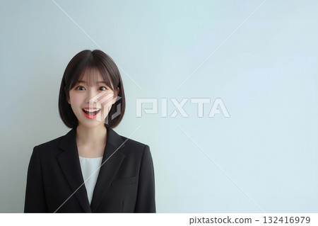 A smiling new female employee in a suit A smiling new female employee in a suit 132416979