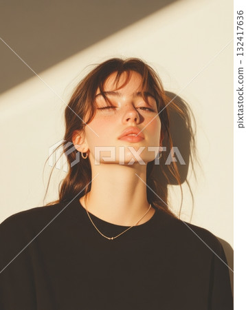 Portrait of beautiful young woman with delicate jewelry necklace and earrings, natural freckles and glowing healthy skin on neutral beige background. Natural beauty skincare wellness concept Portrait of beautiful young woman with delicate jewelry necklace and earrings, natural freckles and glowing healthy skin on neutral beige background. Natural beauty skincare wellness concept 132417636