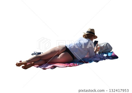 Woman relaxing sunbathing on beach towel using smartphone Woman relaxing sunbathing on beach towel using smartphone 132417953