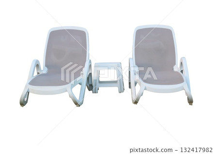 Two lounge chairs and side table for summer relaxation 132417982