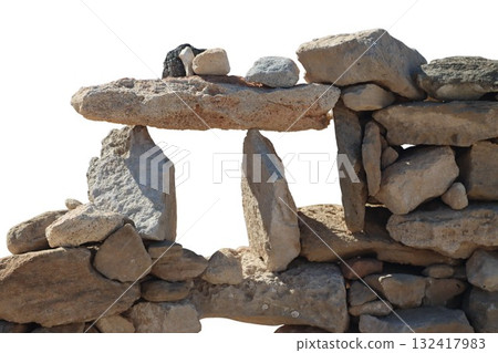 Stacked stones building a balanced rock wall structure Stacked stones building a balanced rock wall structure 132417983
