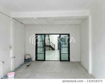 Empty room white wall tile floor glass door metal frame staircase clean minimal 132418373