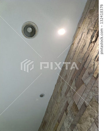 Stone wall recessed light ceiling spotlight modern interior texture detail warm tone minimalist design Stone wall recessed light ceiling spotlight modern interior texture detail warm tone minimalist design 132418376