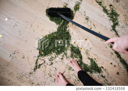 A broom that sweeps the needles from the Christmas tree. A broom that sweeps the needles from the Christmas tree. 132418508