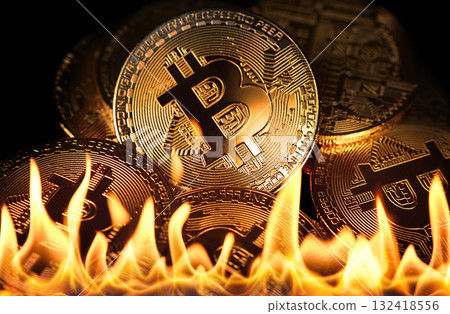 Gold bitcoin physical coins in fire flames 132418556