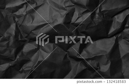 Black crumpled paper creating an abstract texture background 132418583