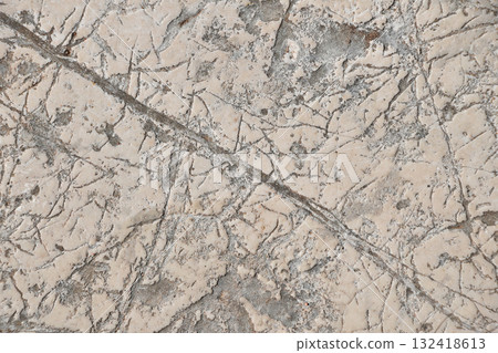 Weathered stone surface showcasing abstract cracked texture Weathered stone surface showcasing abstract cracked texture 132418613