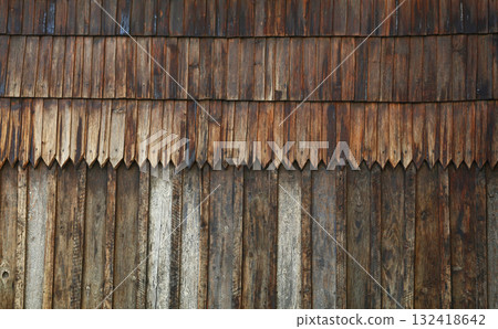 Old weathered wooden shingles creating rustic texture 132418642