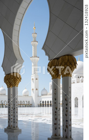 Vertical detail of white mosque minaret framed by white arc, United Arab Emirates 132418928