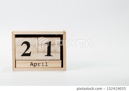 Wooden calendar April 21 on a white background Wooden calendar April 21 on a white background 132419035