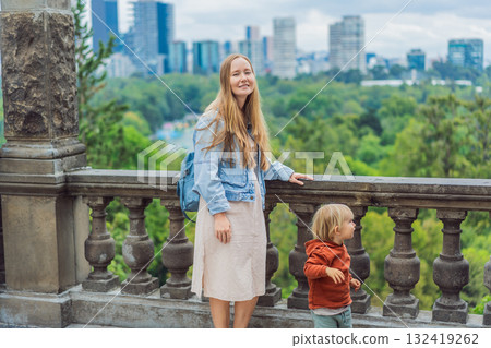 Mother with her young son near Chapultepec Castle in Mexico City, enjoying a cultural family trip. Parenthood, love, heritage sightseeing, and family bonding travel concept Mother with her young son near Chapultepec Castle in Mexico City, enjoying a cultural family trip. Parenthood, love, heritage sightseeing, and family bonding travel concept 132419262