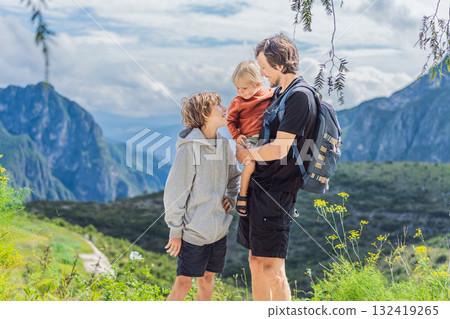 Father with his two sons standing in front of the misty Sierra Madre Oriental mountains near Grutas Tolantongo, Mexico, enjoying family travel, outdoor adventure, and breathtaking nature Father with his two sons standing in front of the misty Sierra Madre Oriental mountains near Grutas Tolantongo, Mexico, enjoying family travel, outdoor adventure, and breathtaking nature 132419265