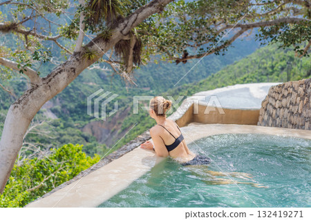 Female tourist exploring Grutas Tolantongo in Mexico, enjoying natural hot springs, scenic caves, and outdoor adventure. Travel, wellness, and sightseeing concept 132419271