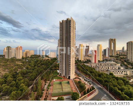 tranquil cityscape scene, serene urban environment featuring skyscrapers and natural surroundings tranquil cityscape scene, serene urban environment featuring skyscrapers and natural surroundings 132419735