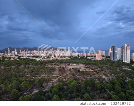 evening lights in busy city, twilight hours bring vibrant lights and active traffic through city evening lights in busy city, twilight hours bring vibrant lights and active traffic through city 132419752