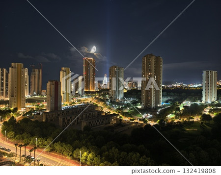 city at night with peaceful ambiance, silent urban night under gentle moonlight illumination 132419808