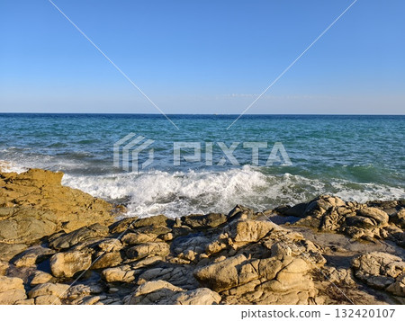 dynamic coastal surf with vibrant imagery, energetic seaside surf scene ideal for promotional 132420107