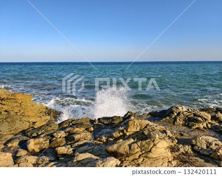 fierce waves meet rugged rocks, powerful sea waves crash against jagged rocky cliffs violently fierce waves meet rugged rocks, powerful sea waves crash against jagged rocky cliffs violently 132420111